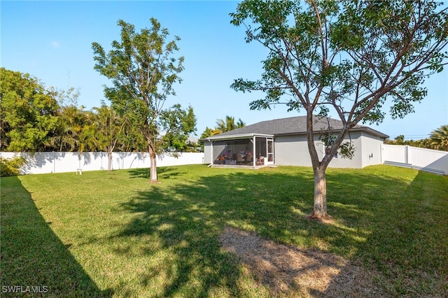 view of yard featuring a sunroom