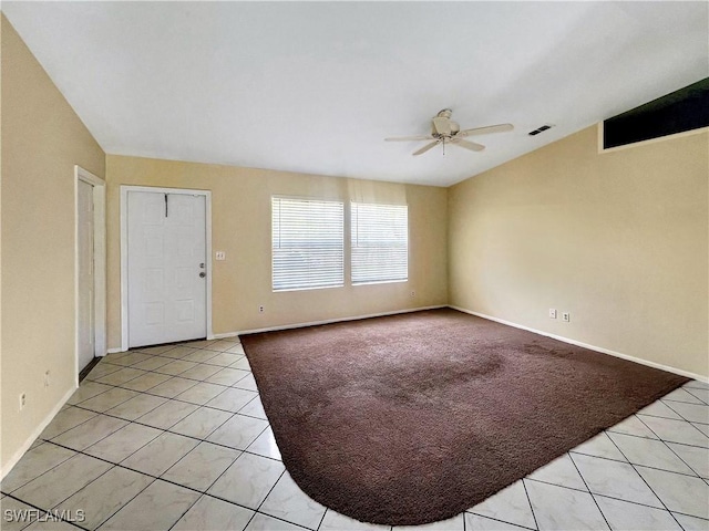 tiled entrance foyer with ceiling fan and vaulted ceiling