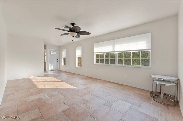 spare room with ceiling fan