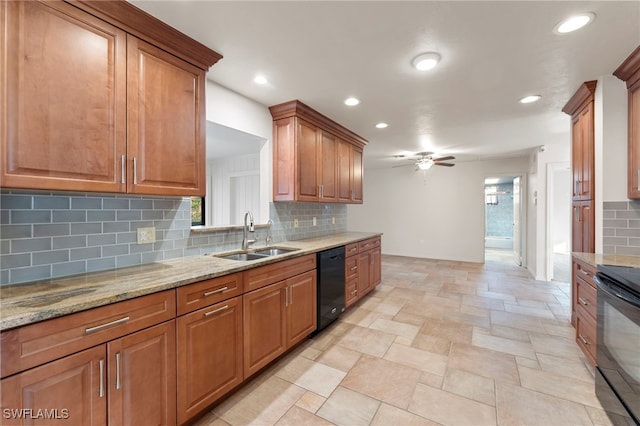 kitchen featuring tasteful backsplash, light stone counters, ceiling fan, black appliances, and sink