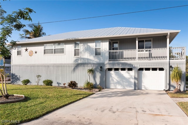 view of front facade with a front yard and a garage