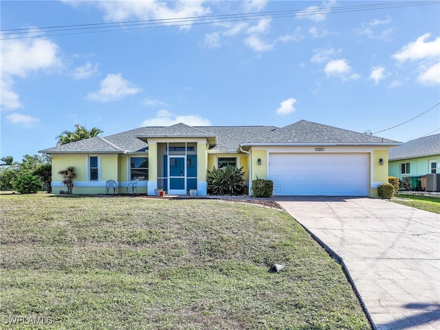 view of front of home featuring a garage, central air condition unit, and a front yard