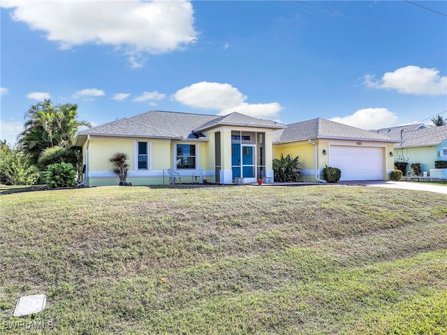 view of front facade with a front lawn and a garage