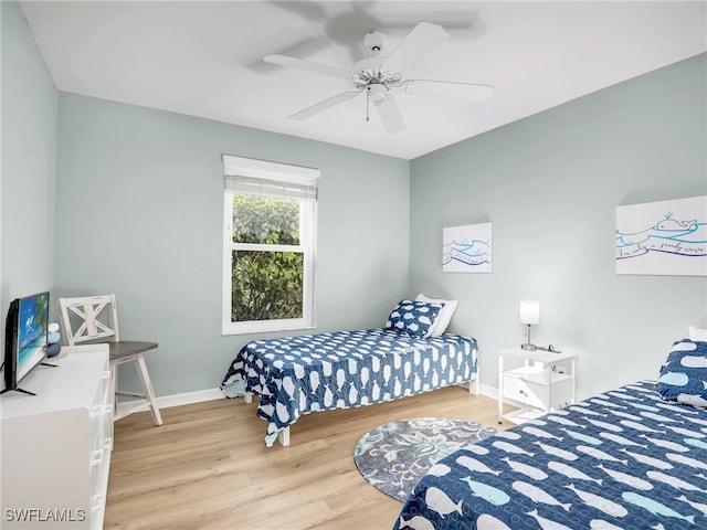 bedroom featuring hardwood / wood-style floors and ceiling fan