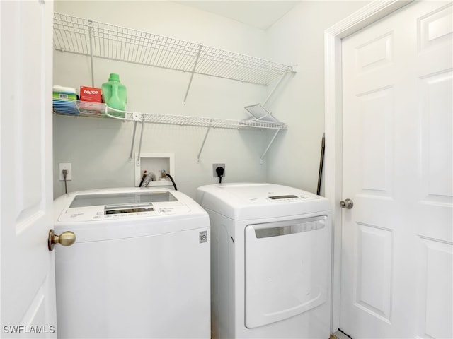 laundry room featuring separate washer and dryer