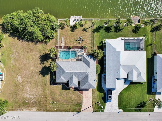 birds eye view of property with a water view