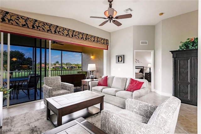 tiled living room featuring ceiling fan and lofted ceiling