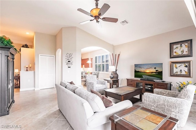 tiled living room with vaulted ceiling and ceiling fan