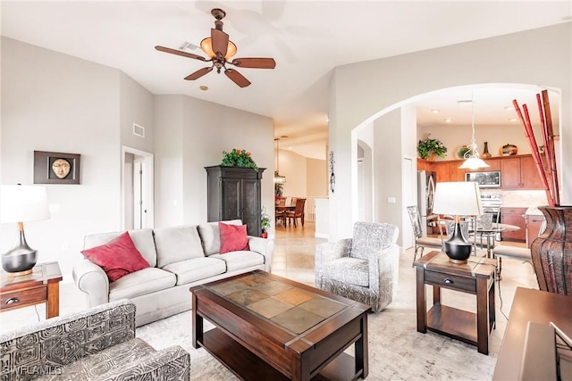 living room with ceiling fan and light tile patterned floors