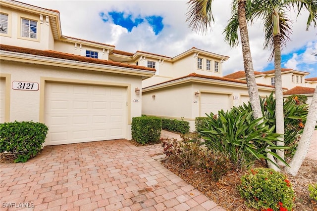 mediterranean / spanish house with a garage