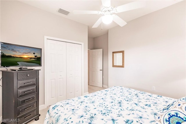 carpeted bedroom with a closet and ceiling fan