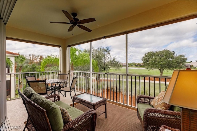 sunroom / solarium with ceiling fan