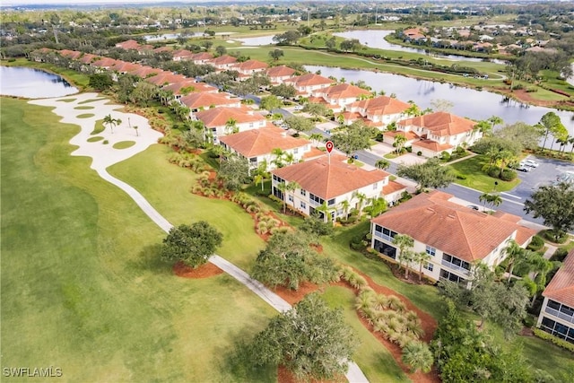 drone / aerial view with a water view