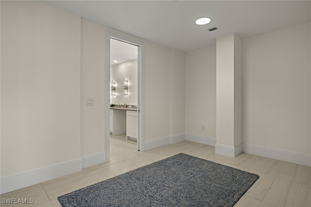 spare room with light tile patterned floors