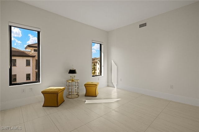 living area featuring light tile patterned flooring