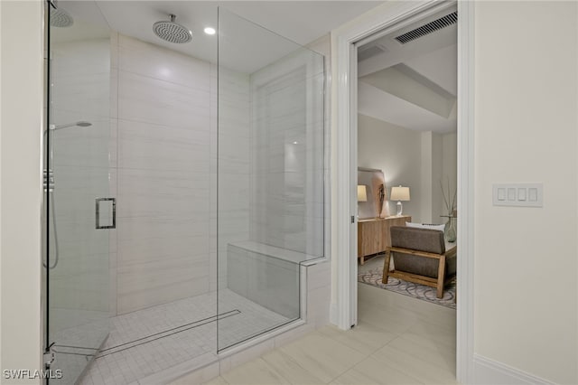 bathroom featuring tile patterned floors and a shower with door