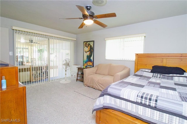 carpeted bedroom featuring access to outside and ceiling fan