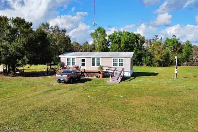 back of house with a yard and a wooden deck