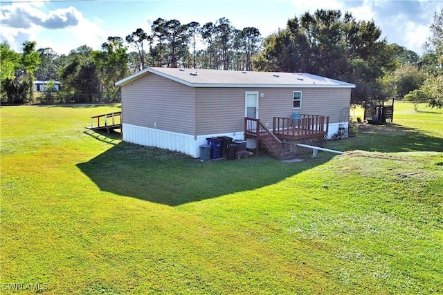 back of property with a lawn