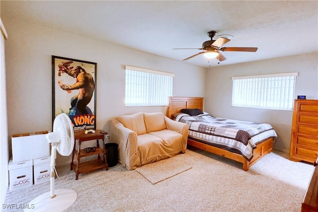 bedroom featuring ceiling fan and light colored carpet