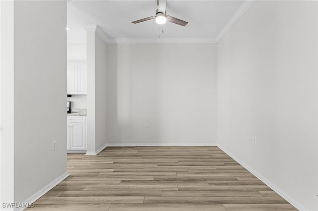 unfurnished room with ceiling fan, crown molding, and light hardwood / wood-style flooring