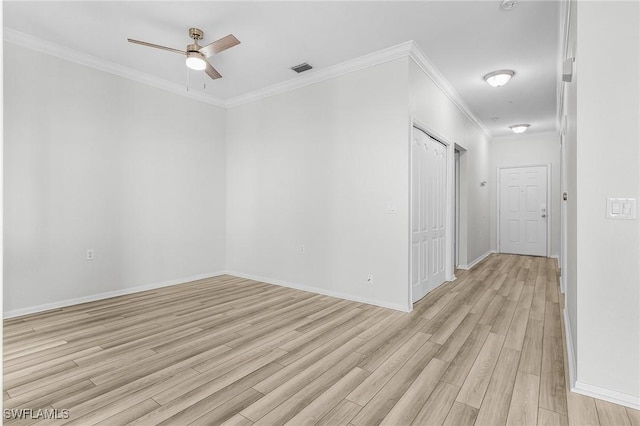 unfurnished room with light hardwood / wood-style flooring, ceiling fan, and ornamental molding