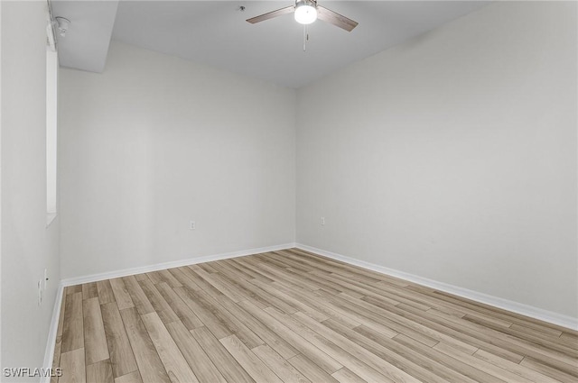 empty room with light hardwood / wood-style flooring and ceiling fan