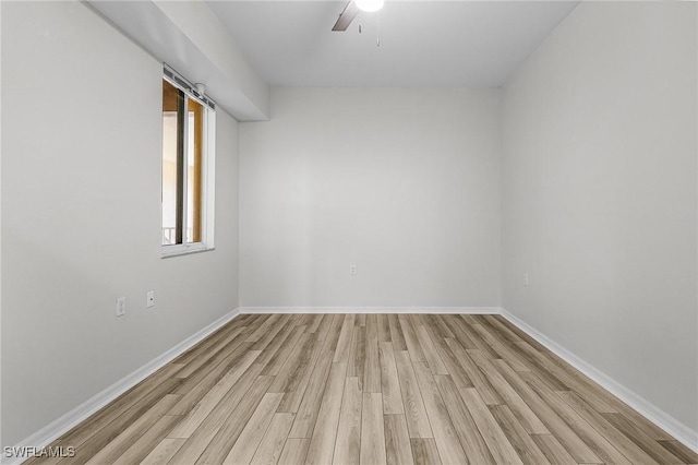 spare room with ceiling fan and light hardwood / wood-style floors