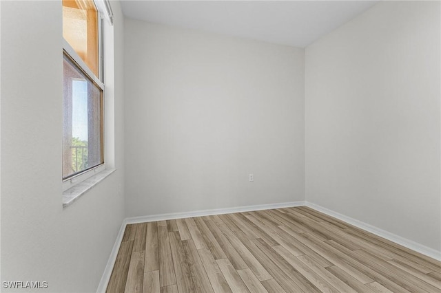 spare room with light wood-type flooring