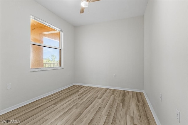 unfurnished room featuring light hardwood / wood-style flooring and ceiling fan