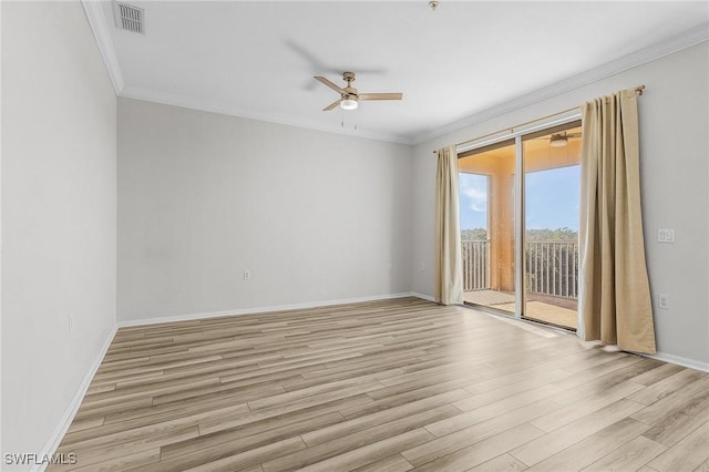 spare room featuring ceiling fan, crown molding, and light hardwood / wood-style floors