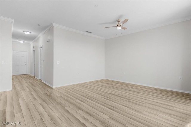 empty room featuring ceiling fan, light hardwood / wood-style floors, and crown molding