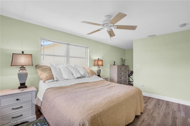 bedroom with ceiling fan and light wood-type flooring