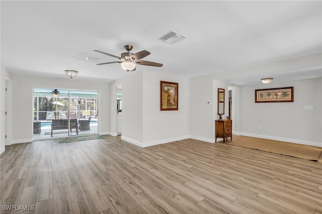 unfurnished living room featuring ceiling fan and light hardwood / wood-style flooring