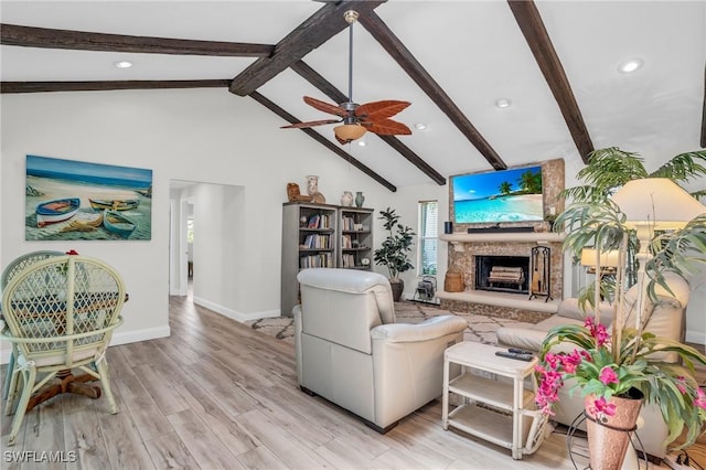 living room with beamed ceiling, ceiling fan, light hardwood / wood-style floors, and high vaulted ceiling