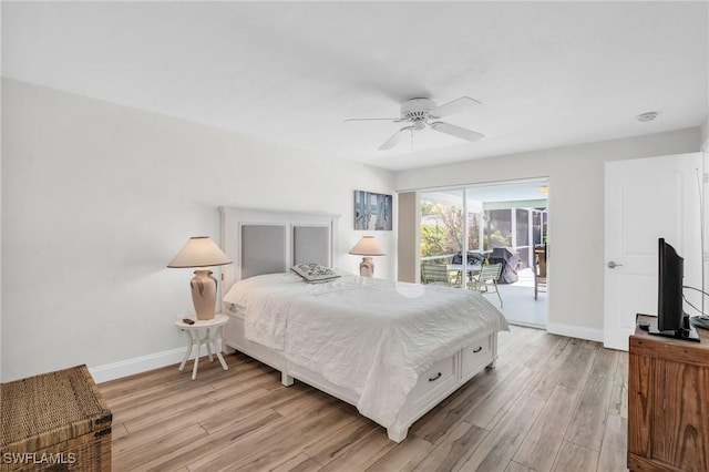 bedroom featuring access to outside, light hardwood / wood-style flooring, and ceiling fan