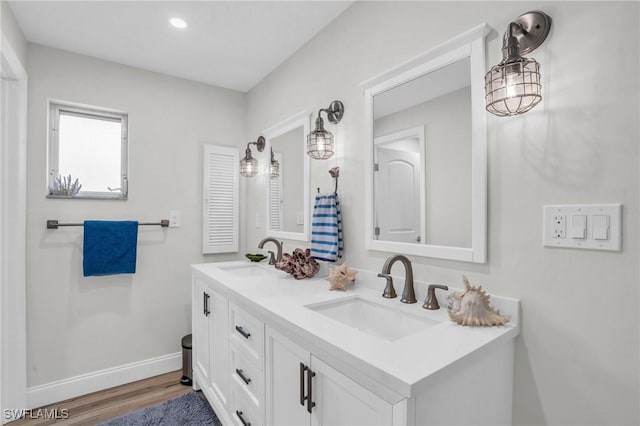 bathroom featuring hardwood / wood-style floors and vanity