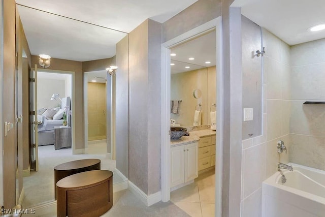 bathroom with tile patterned flooring, vanity, and shower with separate bathtub