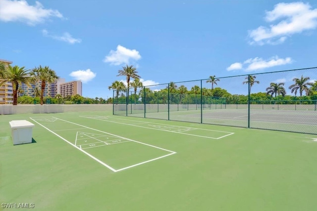 view of community with tennis court