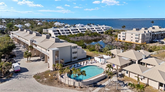 birds eye view of property featuring a water view