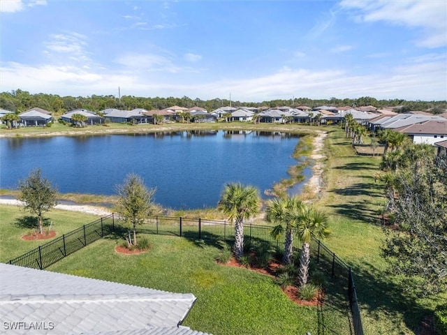 property view of water with a residential view and fence