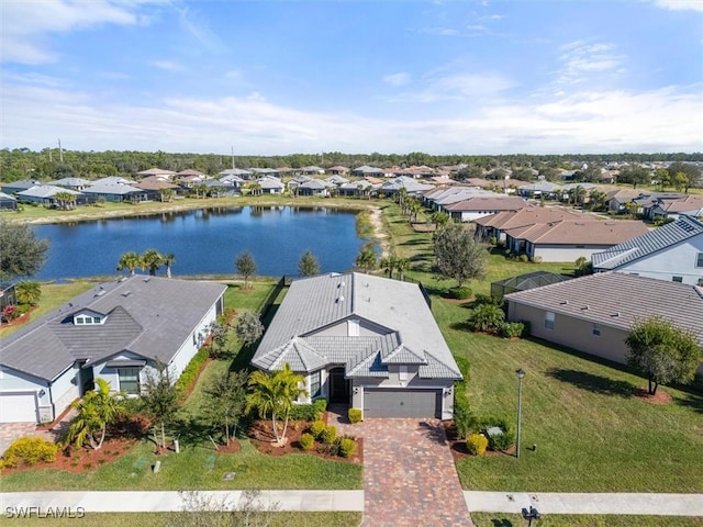 aerial view featuring a water view and a residential view