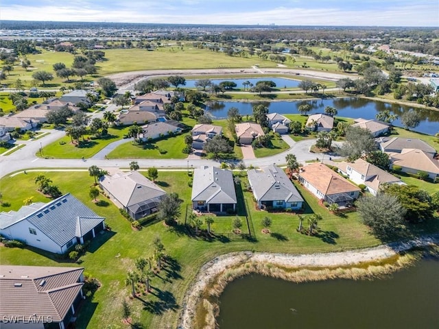 aerial view featuring a residential view and a water view