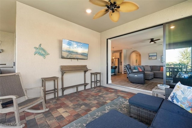 living room featuring ceiling fan