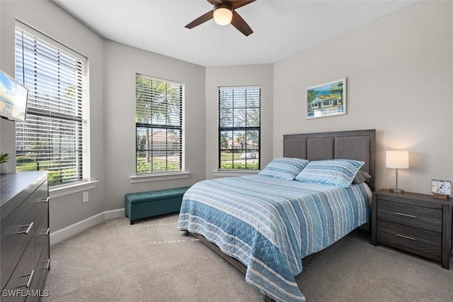 bedroom with light carpet and ceiling fan