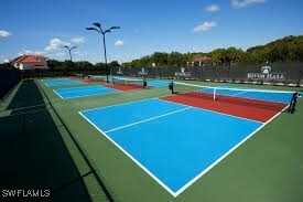 view of tennis court with community basketball court