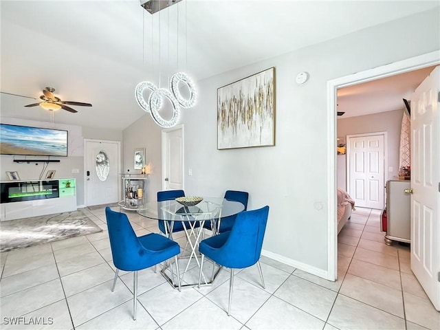 tiled dining room with ceiling fan