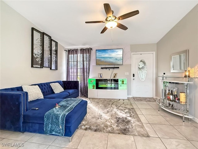 living room featuring ceiling fan and tile patterned flooring