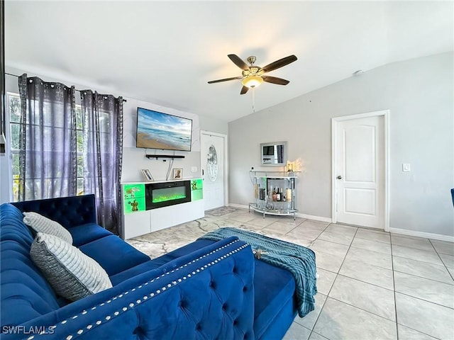 living room featuring tile patterned flooring, ceiling fan, and lofted ceiling