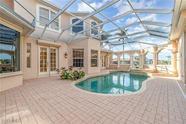 view of pool with a lanai and a patio area